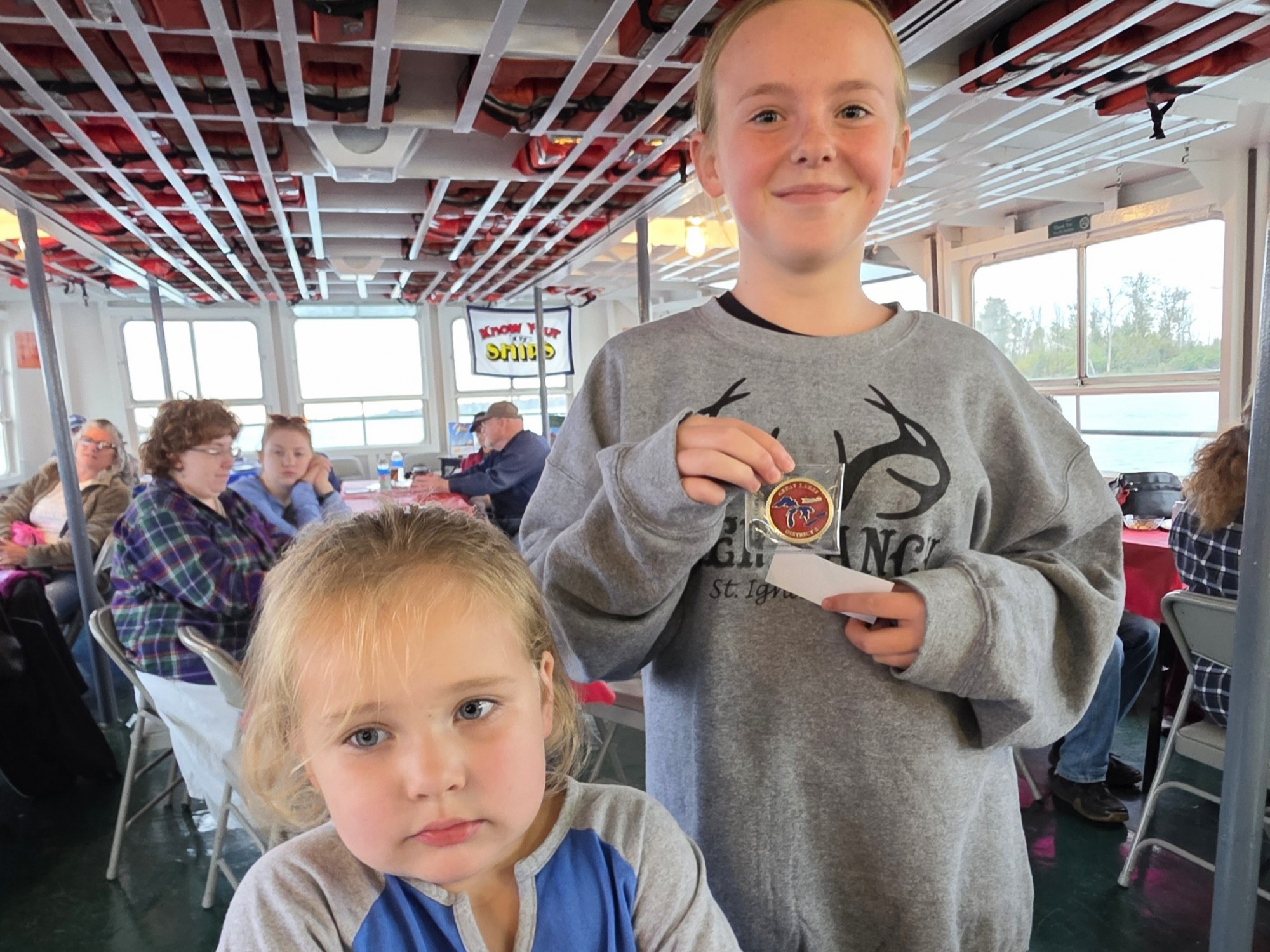 Kids having fun and winning prizes during the Original Soo Locks Boatnerd themed family cruise in Sault Ste. Marie in Michigan’s Upper Peninsula
