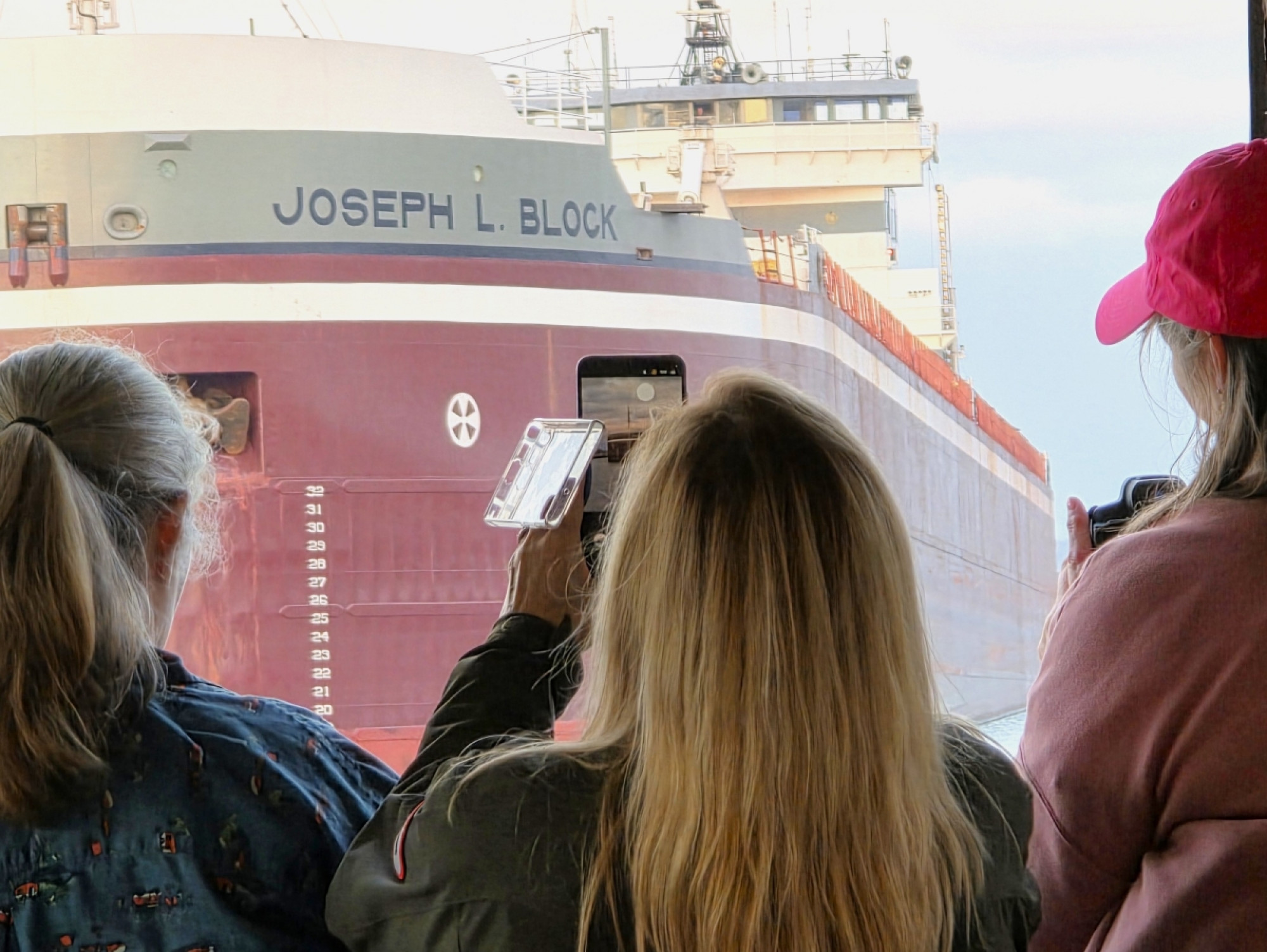 Guest aboard the Original Soo Locks Boatnerd Cruise locked up and up close with the Great Lakes freighter Joseph L. Block in Sault Ste. Marie, Michigan