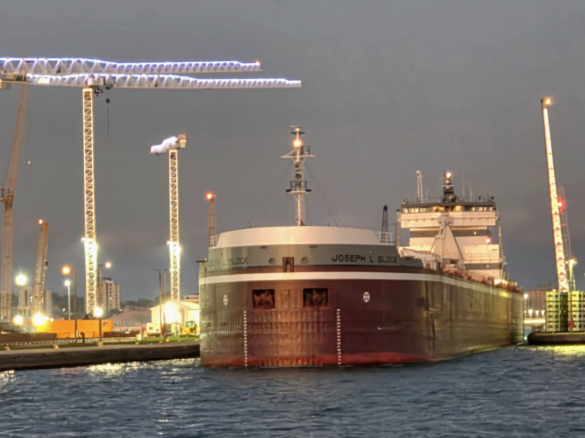 Guests watching the Great Lakes freighter Joseph L. Block exit the Poe Lock while aboard the Original Soo Locks Boatnerd family‑fun cruise in Sault Ste. Marie, Michigan