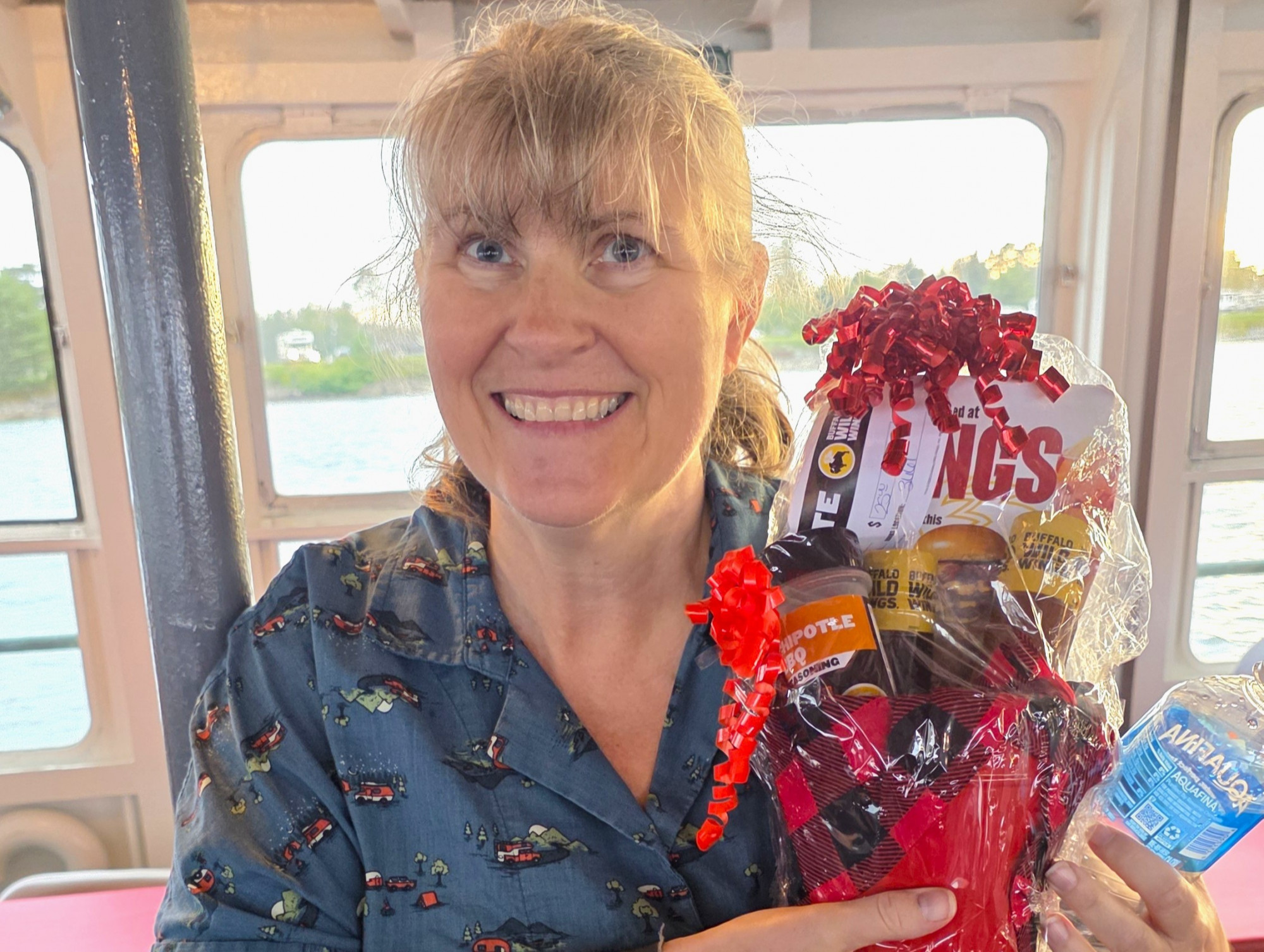 Guest winning a prize during the family‑themed Boatnerd Cruise, one of the fun things to do in Michigan’s Upper Peninsula