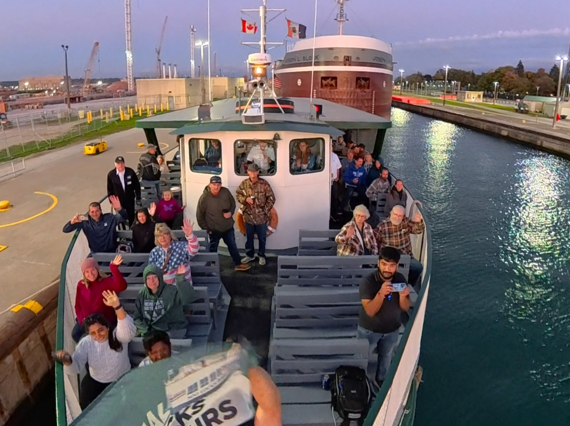 Great Lakes freighter Joseph L. Block locked in the Soo Locks alongside an Original Soo Locks Boatnerd Cruise in Michigan’s Upper Peninsula, sponsored by Interlake Steamship Company and Domino’s Pizza
