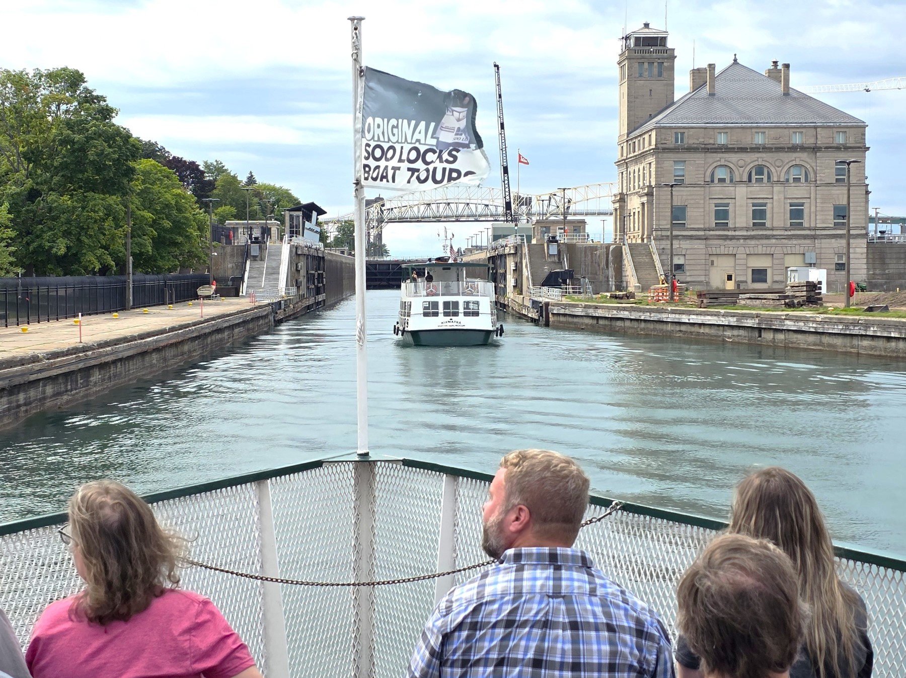 Soo locks tour boats together going into the MacArthur Lock here in Michigan's Upper Peninsula with the Original Soo Locks Tours Sault Ste. Marie 