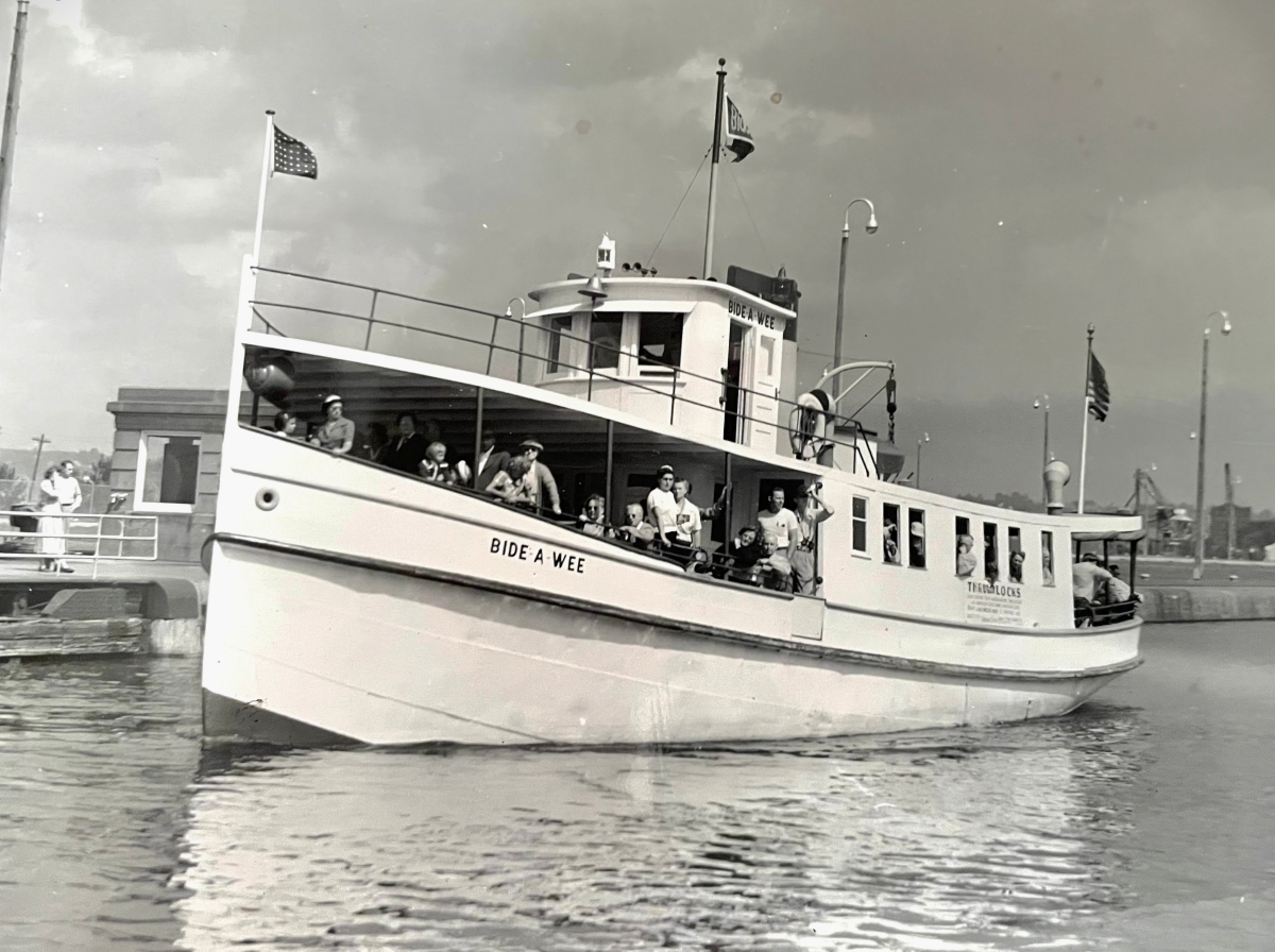 First Soo Locks tour boat Bide-A-Wee from the Original Soo Locks Boat Tours part of Michigan's Upper Peninsula Great Lakes history.