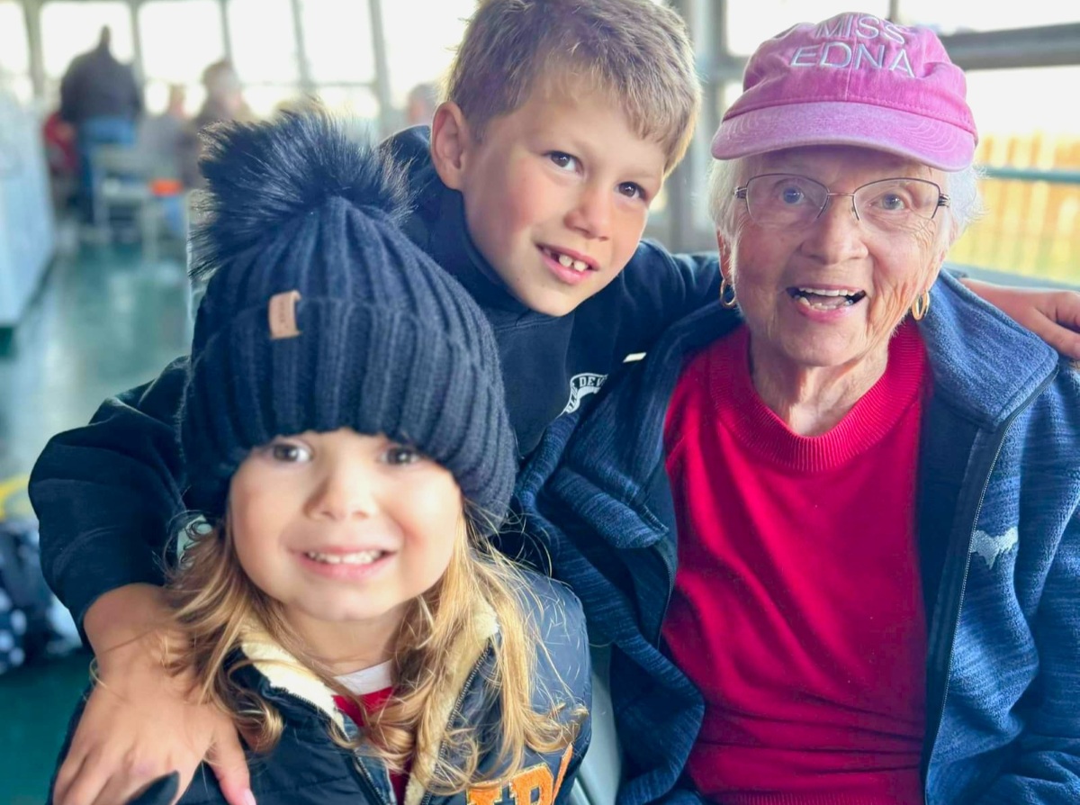 A family enjoying time together onboard during a Original Soo Locks boat tour in Sault Ste. Marie, Michigan.