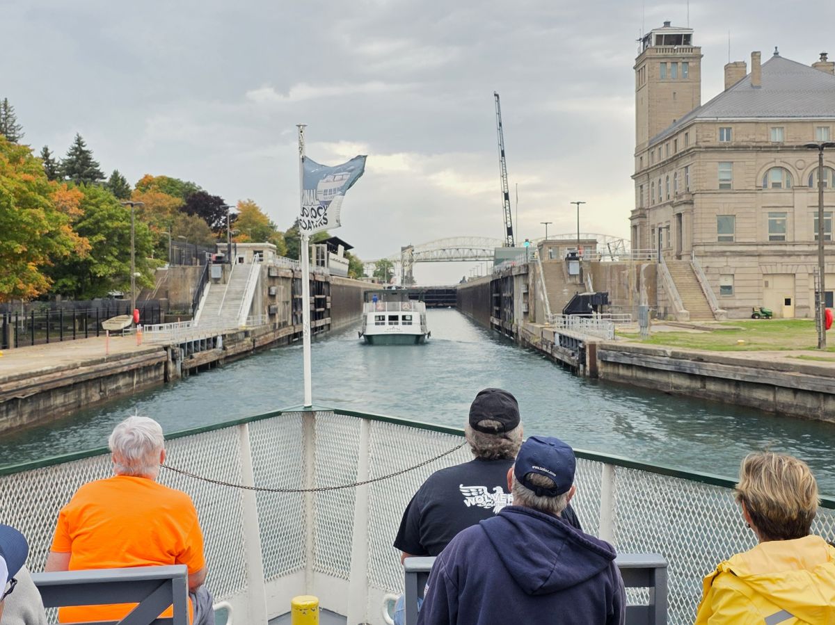 Original Soo Locks tour boat entering the MacArthur Lock with visitors on board