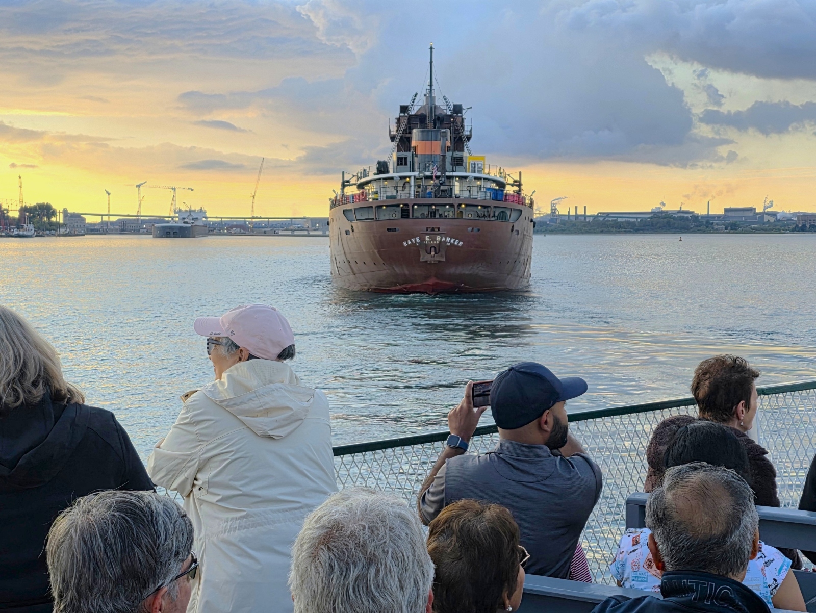 Original Soo Locks Tour Boat following the Key E. Barker up to the Poe Lock on a beautiful sunset evening in Sault Ste. Marie, Michigan