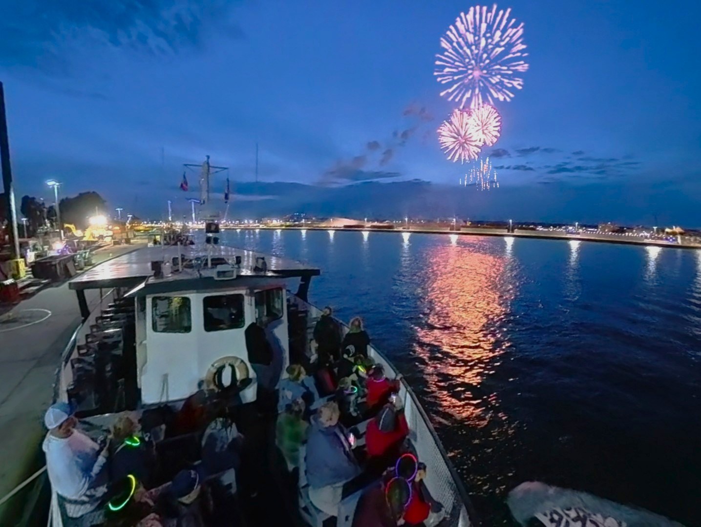 Guest on deck of the tour boat Holiday watching the 4th of July Fireworks in Sault Ste. Marie, Michigan's Original Soo Locks Boat Tours