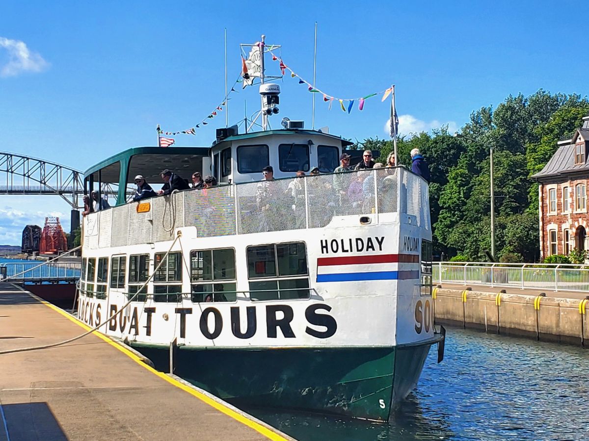 Soo Locks Tour Boat with guest locking through the Canadian Canal in Sault Ontario 